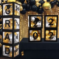 a black and white party with balloons and decorations