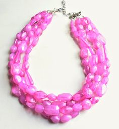 A beaded multi strand statement necklace made with light weight pink Lucite beads of various shapes. - Necklace has 4 strands (more strands available)- Shortest strand measures 19-21" long- Lobster claw clasp is surgical steel (gold filled, sterling silver or gold surgical steel clasp also available) - Connector is lead free pewterThe necklace length and number of strands can be customized. More colors are available. Please let us know what you are looking for. All DLD jewelry comes in a silver Pink Multi-strand Large Beads, Pink Multi-strand Beads For Jewelry Making, Pink Multi-strand Faceted Beads Jewelry, Pink Multi-strand Jewelry With Polished Beads, Pink Multi-strand Jewelry With Faceted Beads, Pink Polished Beaded Necklaces, Pink Multi-strand Faceted Bead Necklace, Pink Multi-strand Faceted Beaded Necklace, Pink Multi-strand Beaded Necklace With Faceted Beads