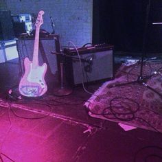 an electric guitar and amp are sitting on the floor