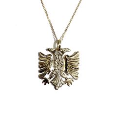 14k gold Albanian double-headed eagle Pendant measures 0.79 inches and weights approx. 4 grams Available in white and yellow gold Symbolic Formal Jewelry With Etched Details, Formal Symbolic Etched Jewelry, Classic Gold Etched Jewelry, Classic Etched Gold Jewelry, Classic 14k Gold Etched Jewelry, Classic Etched 14k Gold Jewelry, Luxury 14k Gold Etched Jewelry, Traditional 14k Gold Collectible Jewelry, Symbolic White Gold Jewelry Stamped 14k