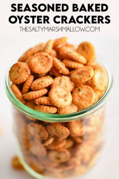 a glass jar filled with seasoned baked oyster crackers