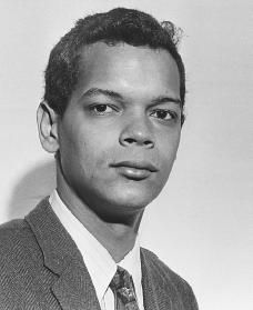 a black and white photo of a man in a suit