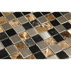 a close up view of a black and brown mosaic tile