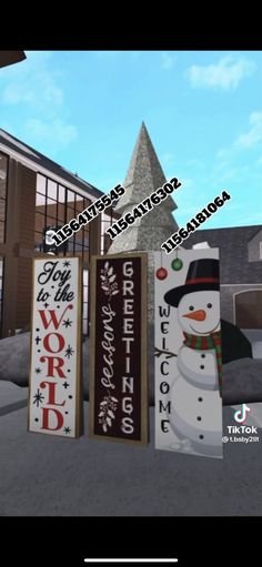 snowmen and christmas signs in front of a building with the words word to word written on them