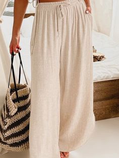 Casual Neutral Wide Leg Pants For Day Out, Chic Solid Color Pants For Beach, Chic Solid Color Beach Pants, Spring Solid Beige Wide Leg Pants, Spring Beige Wide Leg Pants, Chic Wide Leg Pants In Solid Color For Vacation, Chic Solid Color Wide Leg Pants For Vacation, Beige Bottoms For Beach, Beige Non-stretch Wide Leg Pants For Beach