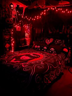 a bed with red lights in a dark room