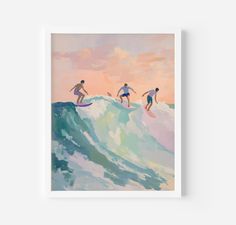 three surfers are riding the waves on their surfboards in front of an orange sky