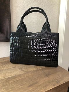 Gorgeous Designer Womens Vintage Genuine Glossy crocodile Alligator Handbag Black, Very RARE. One side made with alligator belly and other side with horn back Description: Crocodile Alligator Skin Bag Depth: 3" Bag Height: 8" Bag Length: 11" Strap Drop: 5.5" Inside Pockets: one big compartment, one zippered pocket and three additional pockets. Pre-Owned Condition. Overall in excellent condition Light scuffs on skin ,mainly bottom corners. Designer Top Handle Satchel With Crocodile Pattern, Designer Crocodile Pattern Rectangular Shoulder Bag, Designer Crocodile Pattern Satchel Shoulder Bag, Designer Shoulder Satchel With Crocodile Pattern, Designer Satchel Shoulder Bag With Crocodile Pattern, Designer Shoulder Bag With Crocodile Pattern Satchel, Designer Crocodile Pattern Satchel, Designer Crocodile Pattern Satchel For Everyday Use, Rectangular Evening Satchel With Crocodile Pattern