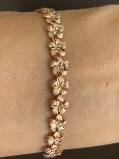 Elegant And Beautiful Hawaiian 14K Solid Rose Gold 8mm Plumeria Flowers Lei Bracelet 8 Inches  Diamond Cut on the Edges of Each Petal. 14K Solid Gold GUARANTEED, Authenticated with a 14K Stamp Made with the Highest Quality Craftsmanship Solid 14K Rose Gold 8mm Plumeria Flowers Lei Bracelet Total Weight 7.4 grams Length 8 Inches Solid 14K Rose Gold Plumeria Flower Width 8 Millimeters Amazing! Gift For Family and Friends! Bracelet Jewelry Gift Box Included! Gold Flower Bracelet, Friends Jewelry, Lavish Lifestyle, Dope Jewelry Accessories, Plumeria Flowers, Hawaiian Jewelry, Rich Money, Jewelry Accessories Ideas, Dope Jewelry