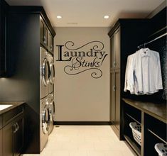 the laundry sink wall decal is next to washer and dryer in this room