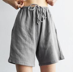 Muslin loose shorts. High waist shorts with ties and pockets. * All clothing made from European muslin (100%  gauze cotton) * OEKO-TEX certified fabric (no harmful chemicals used in production) * Elastic band * Two pockets * From XS to Plus size * Perfect choice for summer TAKING CARE: * machine wash gentle (30- 40 C/ 104 F) * dry gentle. * do not bleach. Each order is sewn with love and attention to detail especially for you. Loose Fit Cotton Shorts For Beach, Loosely Fitted Cotton Shorts For The Beach, Comfortable Summer Shorts With Short Leg, Comfortable Knee-length Shorts For Summer, Natural Clothing, Loose Shorts, Clothing Essentials, Muslin Cotton, Elastic Band