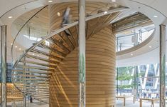 a spiral staircase in the center of a building