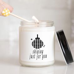 a person holding a toothbrush in a jar with the words shining just for you on it