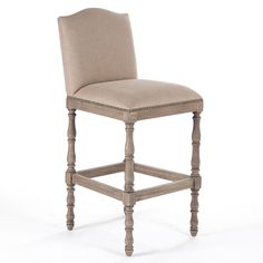 a beige upholstered stool with nail polishing on the legs and backrests