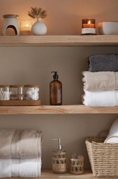 the shelves are filled with towels and other items