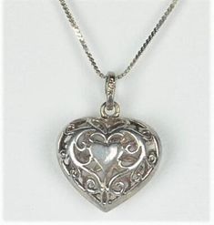 The clasp ring and Pendant Bail are both stamped 925. I have tested the chain and heart and both test as Sterling Silver. I see no legible makers mark anywhere on this item. The Bail Ring that attaches to the spring ring has printing on it that I'm unable to make out. Silver Heart Pendant Necklace Stamped 925, Formal Silver Sterling Heart Necklace, Silver Sterling Heart Necklace For Memorial, Silver Heart Necklace With Box Chain, Silver Heart Pendant Necklace With Box Chain, Silver Theme, Mermaid Artwork, Antique Jewelry Necklace, Sterling Silver Heart Pendant