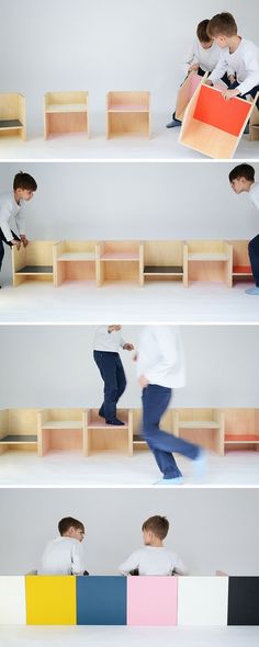 three boys are sitting on the shelves and one boy is holding an object in his hand