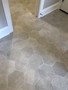 a kitchen floor with hexagonal tiles on it