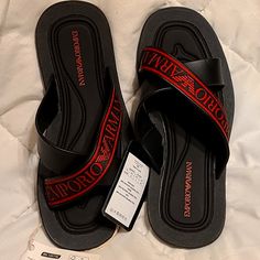 Original, Authenticated Emporio Armani Sandals. Brand New Designer Leather Flip Flops For Summer, Designer Black Flip Flops For The Beach, Designer Black Flip Flops For Beach, Designer Black Leather Flip Flops, Designer Synthetic Slip-on Sandals, Designer Open Toe Flip Flops For Vacation, Designer Open Toe Flip Flops For Spring, Black Leather Flat Flip Flops, Designer Black Sandals With Rubber Sole