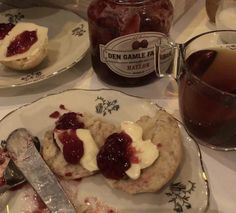 a plate with jam and biscuits on it