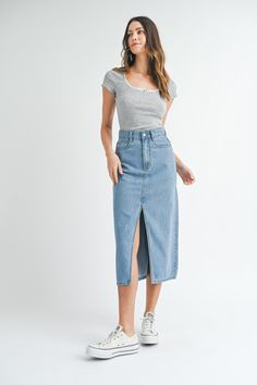 This solid denim midi skirt features a front slit and back shadow pocket detail, making it a stylish and versatile addition to your wardrobe. The slit adds a touch of flair while the pocket detail offers functional convenience. A must-have for any fashion-forward individual. Denim Midi Skirt, New Tops, Pocket Detail, Denim Dress, Denim Skirt, Fashion Forward, Midi Skirt, Active Wear, Skirt