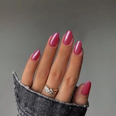 a woman's hand with pink manies and a diamond ring on her finger