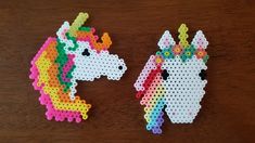 two pieces of perler bead art that look like unicorns