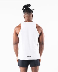 HIGHLIGHTS Raw edge finish at hem Rib knit neck and armscyes Soft and lightweight fabric Rubberized appliqué at chest and back FIT SUGGESTION. This item runs true to Alphalete’s relaxed. fit.. If you are between sizes, we recommend sizing up. Model is 6’1”/185cm, wearing a size L with a 44”/112cm chest.. MATERIALS AND WASHING DIRECTIONS 100% Cotton Comfort Breathability Wash inside out with like colors Cool iron, Iron inside out. Hang to dry Do not bleach Our three pillar tank top is made from a Money Sign, Hip Hip, Ombre Effect, White Tank Top, Inside Out, Mens Tops, How To Wear