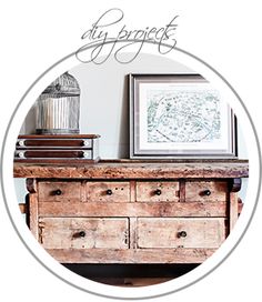 an old wooden table with drawers and a birdcage on top that says swedish work bench restoration