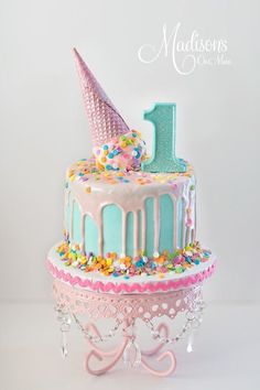 a cake that is decorated with icing and sprinkles on top of it