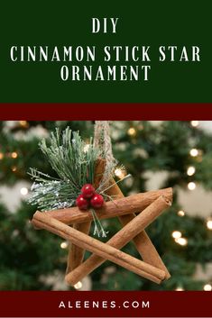 cinnamon stick star ornament hanging from a christmas tree