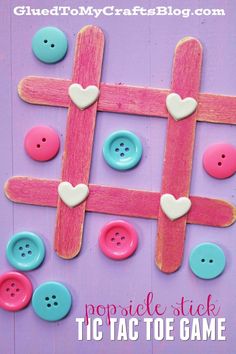 popsicle stick tic toe game for valentine's day with hearts on it