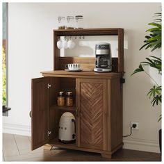 a wooden cabinet with a coffee maker on top and other items in the bottom shelf