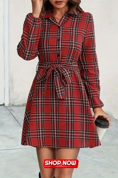 This Plaid Print Shirt Dress boasts an elegant design with a button front and long sleeves. The classic yet stylish plaid pattern exudes sophistication. Versatile and chic, it’s a perfect blend of formal and casual, ideal for those seeking timeless fashion with a contemporary touch. Fall Mini Length Shirt Dress With Buttons, Collared Shirt Dress With Button Closure For Winter, Winter Collared Shirt Dress With Button Closure, Red Shirt Dress With Buttons For Fall, Casual Button-up Mini Dress For Winter, Casual Plaid Dress With Buttons, Casual Buttoned Shirt Dress For Winter, Casual Winter Shirt Dress With Buttons, Winter Casual Shirt Dress With Buttons