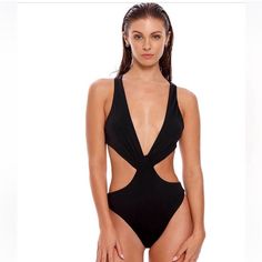 Elevate Your Beach Style With The Agua Bendita Fera One-Piece Swimsuit. This Bold Black One-Piece Features Crisscross Straps, A Trendy Cutout Waist, And An Open Back For A Chic And Flattering Look. The Moderate Coverage Ensures You Feel Confident And Comfortable While Lounging By The Pool Or At The Beach. Made From A High-Quality Blend Of Nylon And Elastane, This Swimsuit Is Both Stylish And Durable. Hand Wash Recommended. Imported. Make A Statement With Agua Bendita, Known For Their Bold Swimwe Black One Piece, Designer Swimwear, Bold Black, The Pool, Beach Style, At The Beach, Womens Swim, One Piece Swimsuit, Open Back