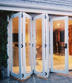 an open patio with french doors leading to the dining room