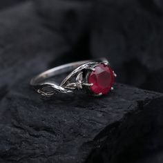 This Ring comes with a 100% Natural Ruby Gemstone and it is made up of 925 solid sterling silver. This ring is handcrafted by our skilled craftsmen and designed by us. Every gemstone is handpicked for the best quality.  Materials:- Silver (925 Solid Sterling Silver) Gemstone:- Natural Red Ruby  Item Weight :- Approx. 4 Grams Stone Size :- 8 MM Stone Shape :- Round Cut Select Size in Variation, if you don't find perfect size please buy any size and message us your size we'll make. Payment Policy Hand Forged Round Ruby Rings, Hand Forged Sterling Silver Ruby Ring, Rings Red Stone, Twisted Band Ring, July Birthstone Ring, Nature Inspired Rings, Vintage Silver Rings, Twisted Band, July Birthstone