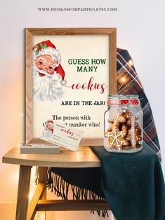 a wooden table topped with a glass jar filled with christmas cookies next to a sign that says guess how many cookies are in the jar