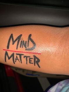 a person with a tattoo on their arm that says, mind matters matter written in black ink