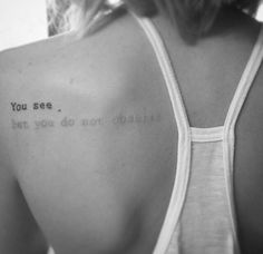 the back of a woman's shoulder with writing on it that says, you see what you do not believe