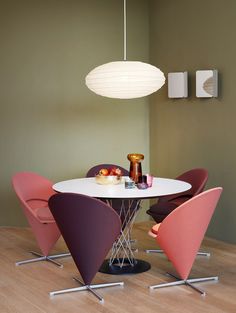 a white table with four chairs around it