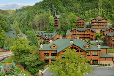 an aerial view of a resort surrounded by trees