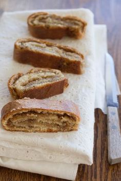 sliced banana bread sitting on top of a white napkin