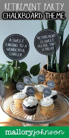 there are cupcakes on the cake plate with chalkboard signs in front of them