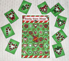 a christmas themed board game with candy canes and candies on the top, surrounded by green squares