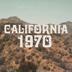 the words california 1970 written in white on top of a mountain