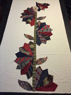 a white table cloth with several different types of ties on it