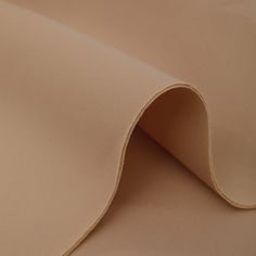 a close up view of a tan fabric