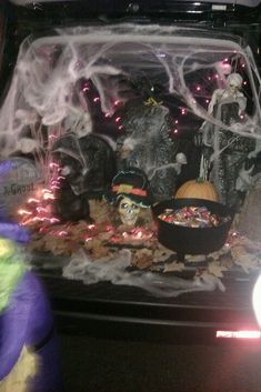 the trunk of a car decorated for halloween