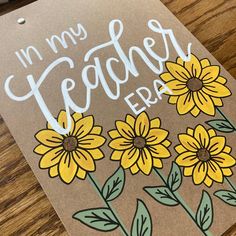 a brown card with yellow flowers and the words i'm my teacher today on it